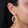 glow-106868500-goudkleurige-oorhangers-met-zirkonias-en-dubbele-ringen-25-mm-breed-hoogte-38-mm