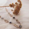 gouden-collier-met-blauw-topaas-en-open-schakels