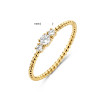 gouden-ring-met-bolletjes-en-drie-zirkonia-s