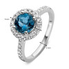 witgouden-entourage-ring-met-diamanten-en-blauwe-topaas