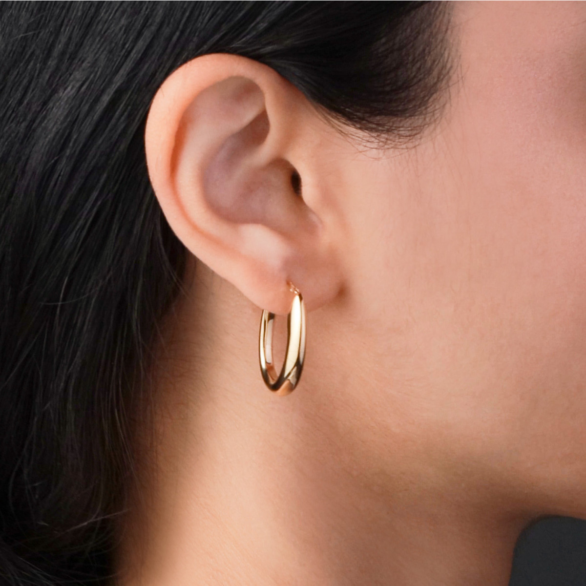 GLOW 107.8674.00 gold plated ovale oorringen glanzend 4 mm breed - Hoogte 24 mm