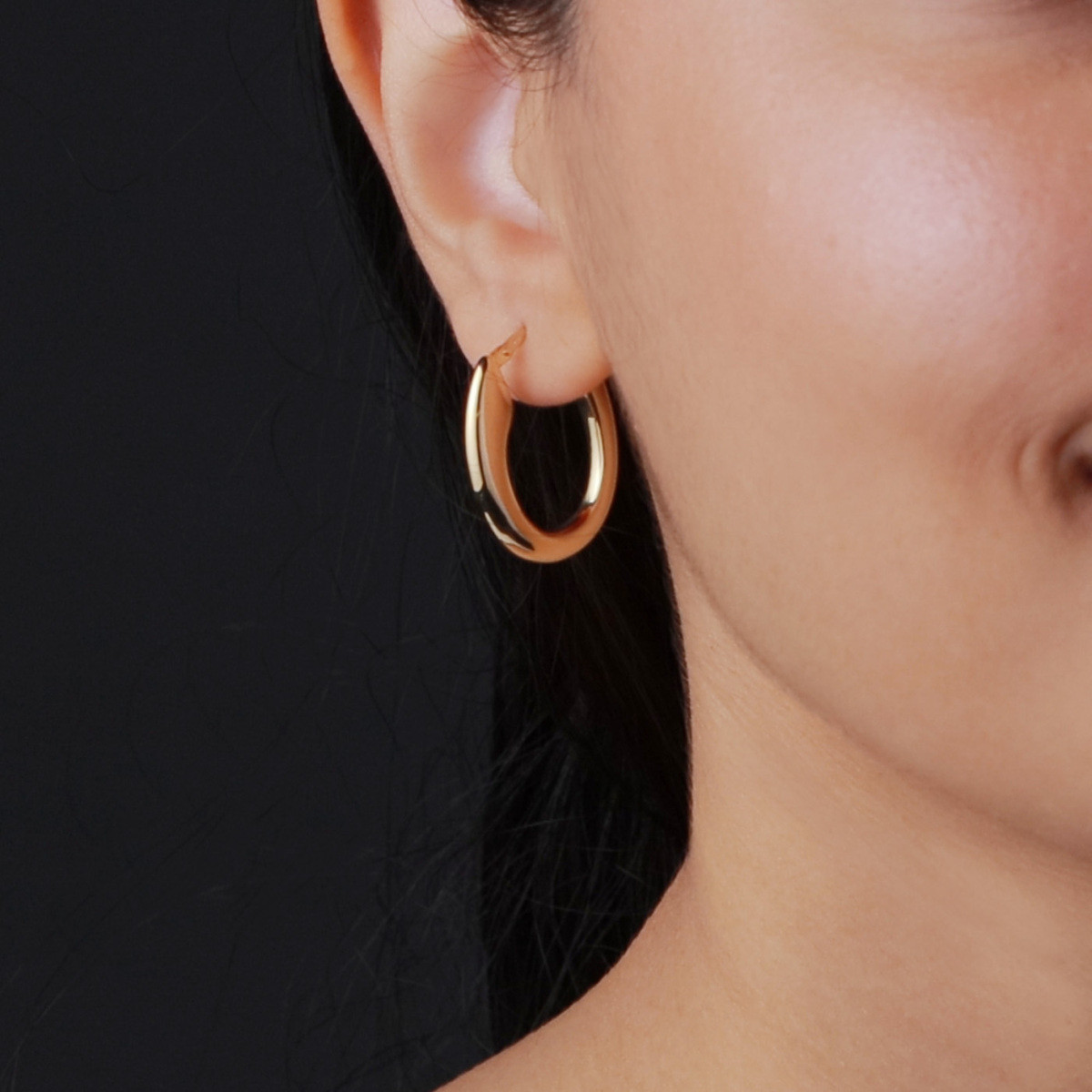 GLOW 107.8674.00 gold plated ovale oorringen glanzend 4 mm breed - Hoogte 24 mm