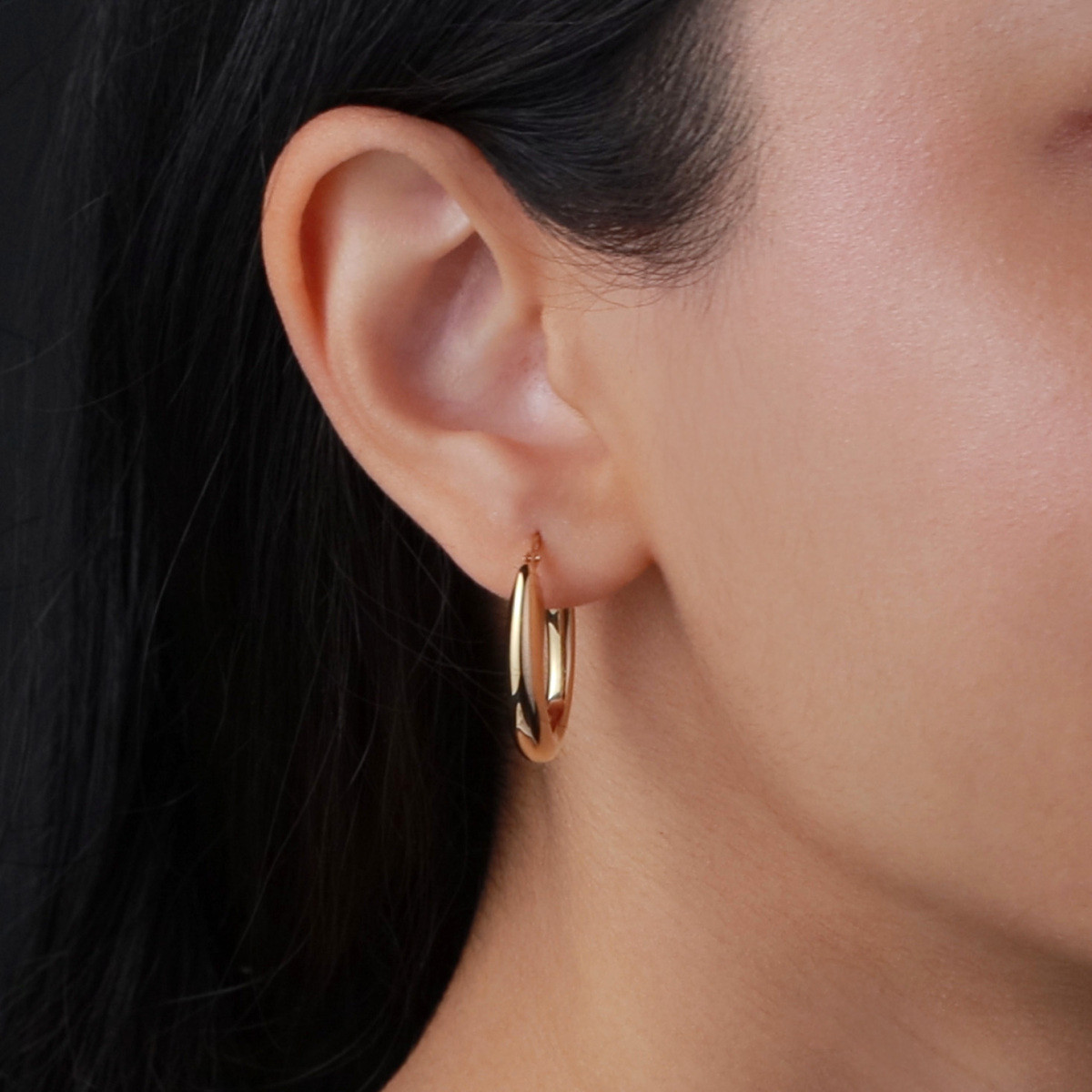 GLOW 107.8674.00 gold plated ovale oorringen glanzend 4 mm breed - Hoogte 24 mm