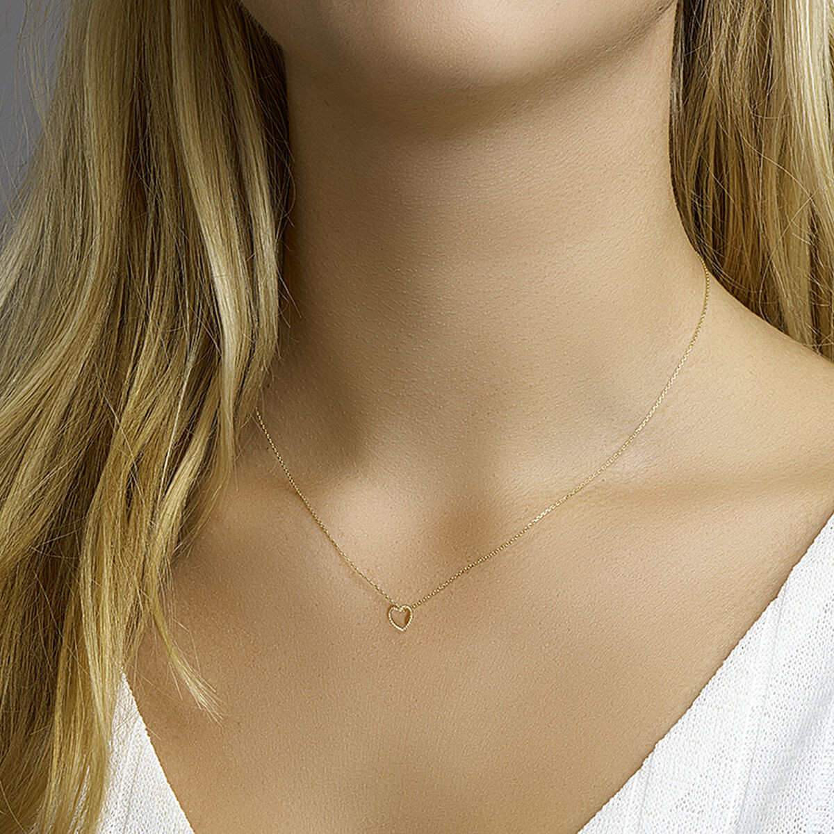 Gouden ketting met hartje twisted