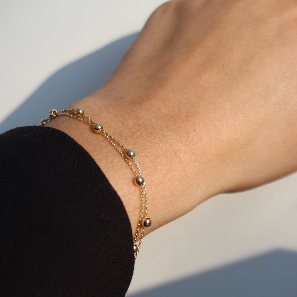 GLOW 204.2131.19 gouden schakelarmband met ronde bolletjes glanzend 3 mm breed - Lengte 19 cm