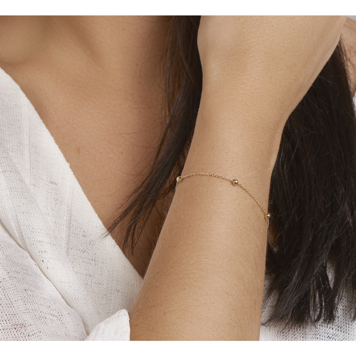 Gouden armbandje met bolletjes