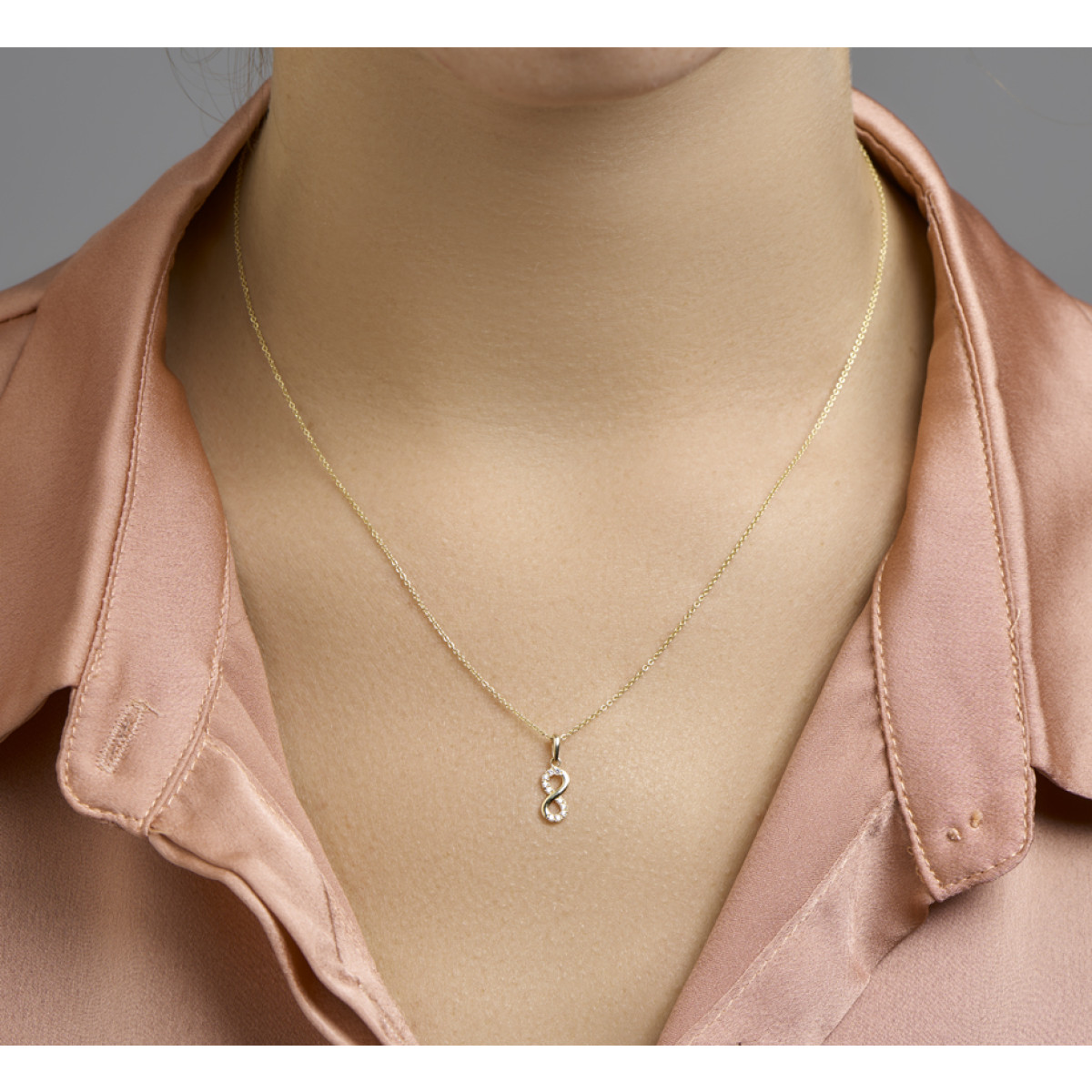 Gouden hanger infinity