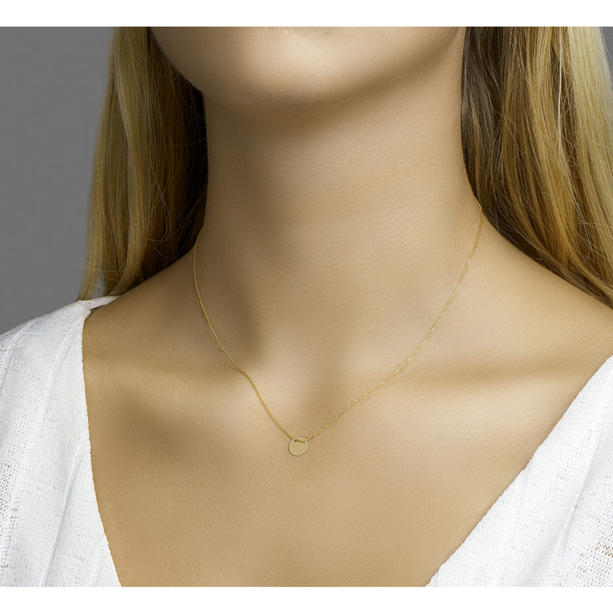 Gouden ketting met munt