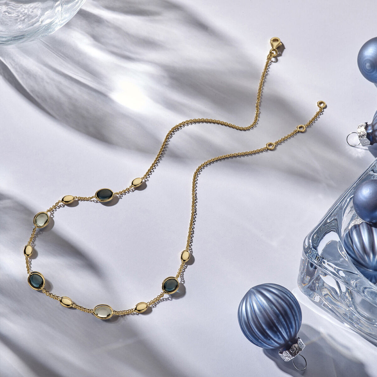 Gouden ketting met edelsteen topaas