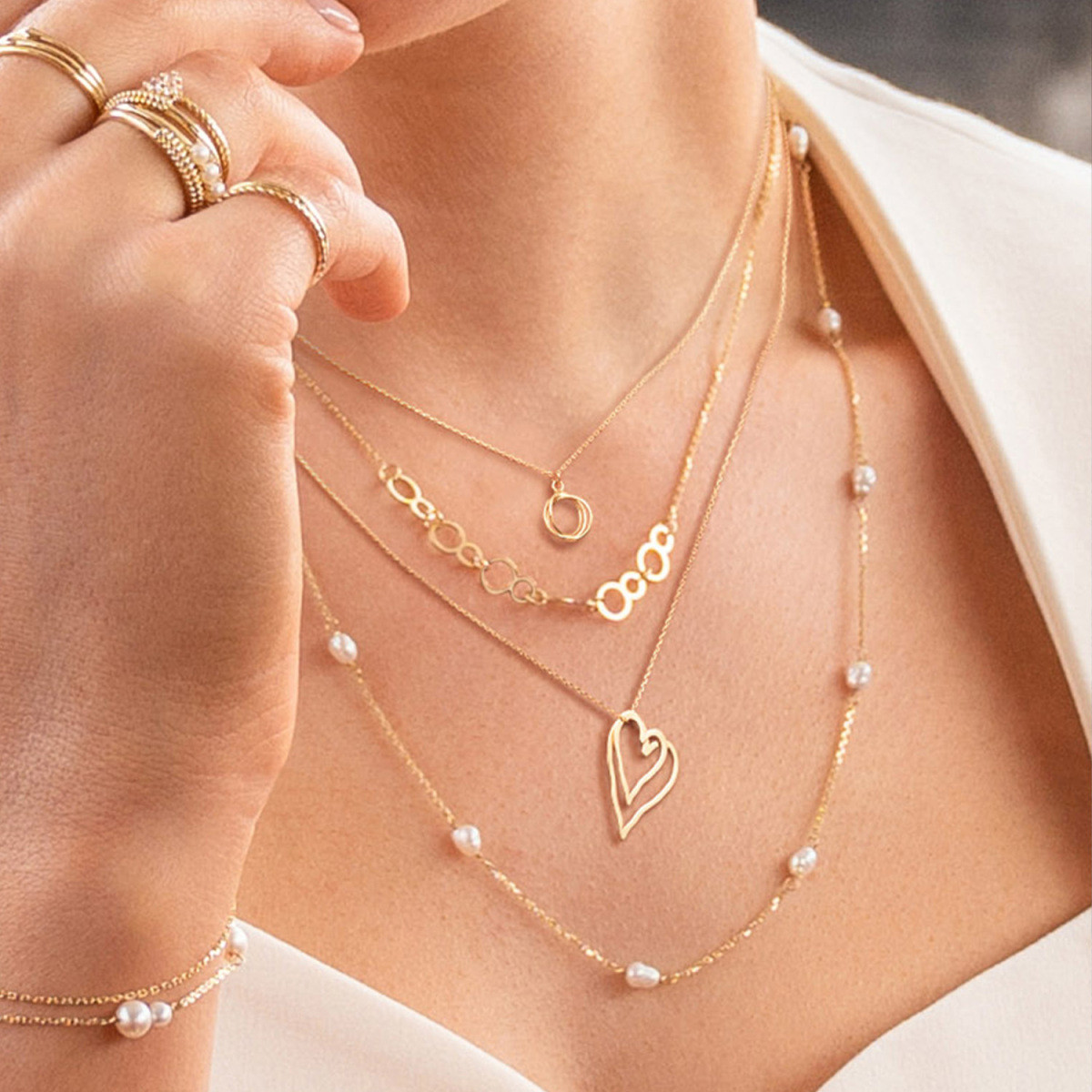 Jackie Gold JKN25.555 14-karaat gouden collier met abstract hartje - Lengte 40-42.5-45 cm