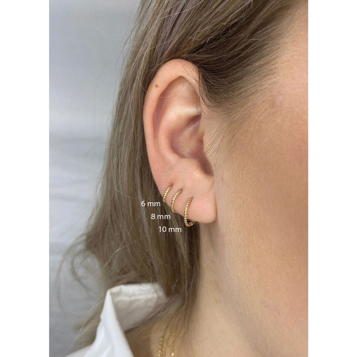 Jackie Gold JKS22.140 twist oorring 14-karaat goud 6 mm diameter - per stuk