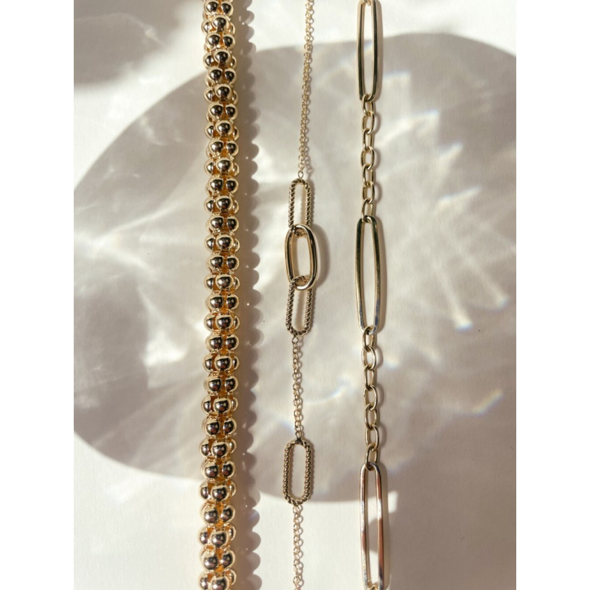 14-karaat gouden armband met 4 glanzende en gedraaide paperclip schakels - Lengte 19 cm