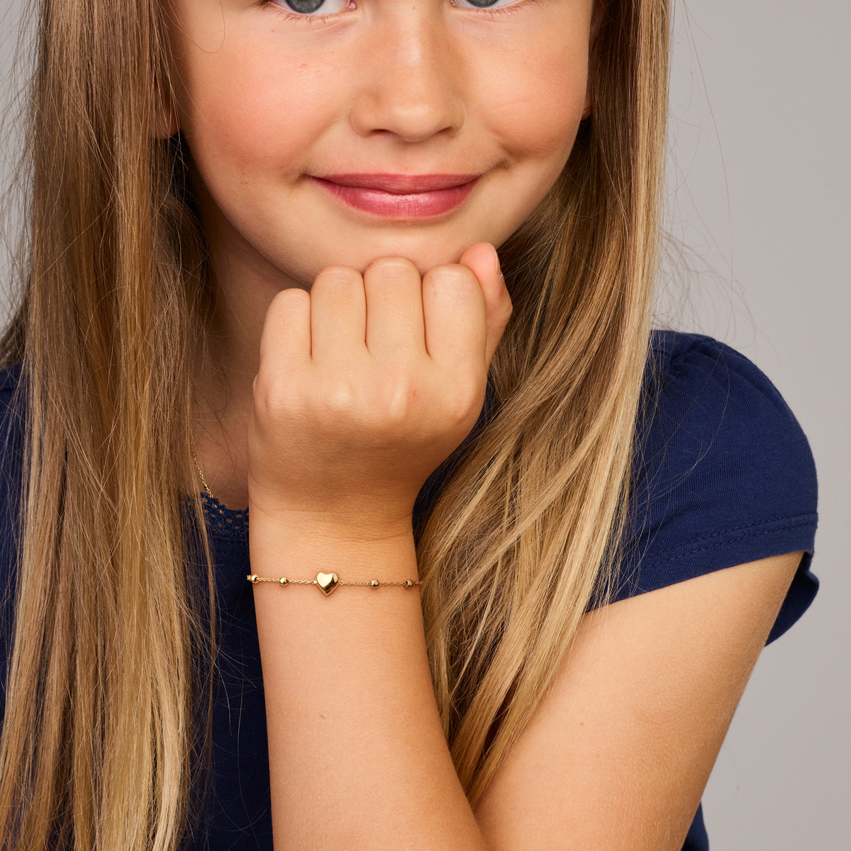 14-karaat gouden kinderarmband met hartje en bolletjes - Lengte 11-13 cm