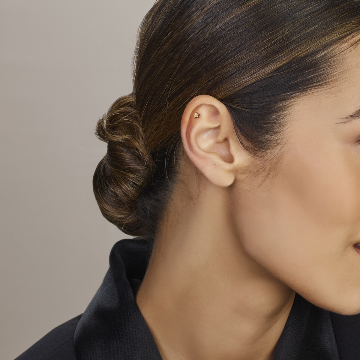 Goudkleurige ster flatback piercing met transparante zirkonia glanzend - per stuk